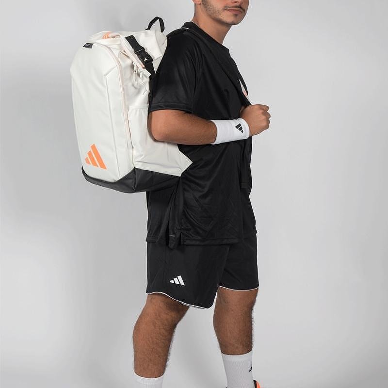 Раница adidas Backpack Multigame Off White 2026 за падел, бяла с оранжеви акценти, с roll-top основно отделение и термоизолирано отделение за ракети